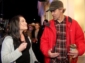 The co-holders of first place in line - Nikki Rose and Ian Power - became the first people to legally buy pot in Canada at midnight in St. John's, NL.