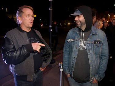 Linton (left) chats with those in the lineup outside. Bruce Linton, founder, CEO and Chairman of Canopy Growth, travels from Ottawa to St. Johns, Newfoundland on the eve of legalization of pot in Canada to sell the first gram of legal pot from his Tweed store in St. Johns at the stroke of midnight - long before it becomes legal in all the other provinces.