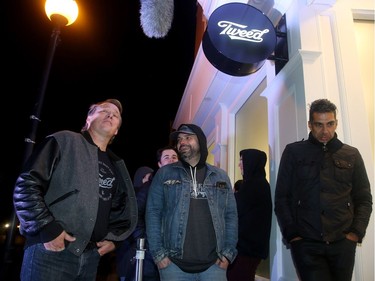 Bruce Linton (left) chats with people lining up outside the Tweed store in St. John's , NL