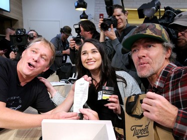 The co-holders of first place in line - Nikki Rose and Ian Power - became the first people to legally buy pot in Canada at midnight.