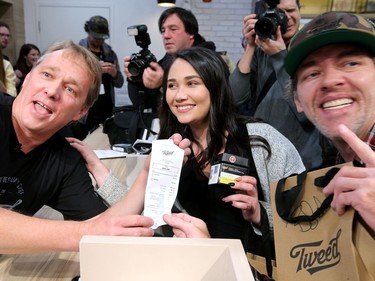The co-holders of first place in line - Nikki Rose and Ian Power - became the first people to legally buy pot in Canada at midnight. Bruce Linton (left), founder, CEO and Chairman of Canopy Growth, travels from Ottawa to St. Johns, Newfoundland on the eve of legalization of pot in Canada to sell the first gram of legal pot from his Tweed store in St. Johns at the stroke of midnight - long before it becomes legal in all the other provinces.