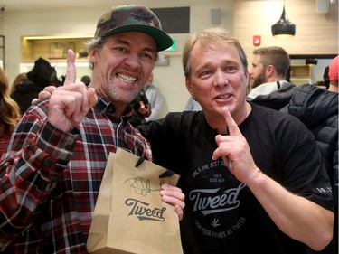 The co-holder of first place in line - Ian Power (along with Nikki Rose, not pictured) - became the first people to legally buy pot in Canada at midnight. Bruce Linton (right, founder, CEO and Chairman of Canopy Growth, travels from Ottawa to St. Johns, Newfoundland on the eve of legalization of pot in Canada to sell the first gram of legal pot from his Tweed store in St. Johns at the stroke of midnight - long before it becomes legal in all the other provinces.