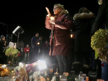 A woman blows a kiss skyward after leaving her white coronation at a vigil held in the memory of  Émilie Maheu on Wednesday evening (Oct. 24, 2018) in Alexandria.