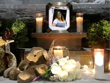 Stuffed toys for Émilie Maheu's daughter were mixed with candles and white carnations at a vigil on Wednesday evening (Oct. 24, 2018) in Alexandria.