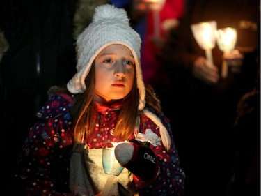 Mourners young and old held candles and reminisced about Émilie Maheu at a vigil in her memory Wednesday evening (Oct. 24, 2018) in Alexandria.