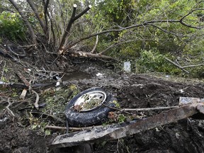 Debris scatters an area Sunday, Oct. 7, 2018, at the site of yesterday's fatal crash Schoharie, N.Y. (AP Photo/Hans Pennink)