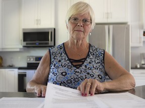 Councillor Judy Farrell looks through documents at home in Tay Valley.f