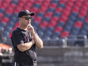 Head coach Rick Campbell watches Redblacks players in action during practice at TD Place stadium on Tuesday.