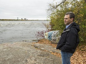 Roland Paris walks along the portage trail at Little Chaudière Rapids on the Quebec side of the Ottawa River.