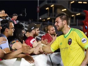 Fury FC goalkeeper Maxime Crépeau exchanges greetings with happy fans after a 3-0 victory against Toronto FC II on May 31. Steve Kingsman/Freestyle Photography/Ottawa Fury FC