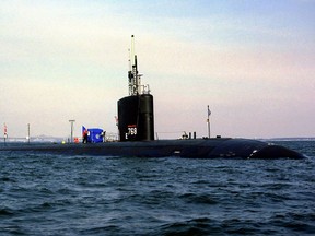Ih this file photo, the nuclear-powered fast attack submarine USS Hartford is moored off the U.S, Naval Academy in 1999 in Annapolis, Maryland. The U.S. Navy had accumulated more than 12,000 years of small reactor know-how – via the operation, starting in 1958, of hundreds of nuclear powered ships.