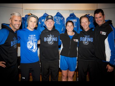 The blue team of fighters, from left, Rick Hiladie, Derek Newberry, Scott McRae, Lisa Langevin, Wayne Liko and Matt Jacques.