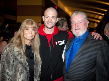 Fighter Michael Bradley with Michele and Larry Bradley, who are with the Heart and Crown Irish pubs, the presenting sponsor of the event.