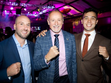 From left, Kyle Turk, director of marketing and communications for Welch LLP, Michael Burch, managing partner with Welch LLP and a past fighter, and Otis Moore.