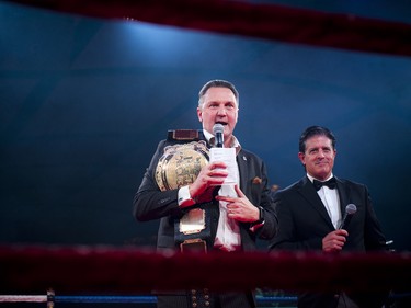 Walter Robinson, who has taken part in five fights over the past 10 years, addresses the crowd with Chris Gauthier (right).