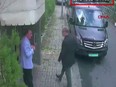 This video grab made on October 10, 2018 from CCTV footage obtained from Turkish news agency DHA shows Saudi journalist Jamal Khashoggi (R) arriving at the Saudi Arabian consulate in Istanbul on October 2, 2018.