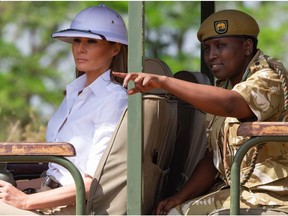 (FILES) In this file photo taken on October 4, 2018 US First Lady Melania Trump goes on a safari with Nelly Palmeris (R), Park Manager, at the Nairobi National Park in Nairobi,  during the third leg of her solo tour of Africa.