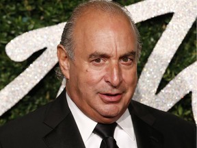 (FILES) In this file photo taken on December 01, 2014 British businessman Philip Green poses for pictures on the red carpet upon arrival to attend the British Fashion Awards 2014 in London. - British fashion industry billionaire Philip Green was named by a member of the House of Lords on October 25, 2018, as the businessman who used an injunction to suppress the publication of sexual harassment allegations by five employees. House of Lords peer Peter Hain told a hushed session Thursday that he was using his "parliamentary privilege" to disclose the alleged businessman's name. The allegation against 66-year-old Green -- whose international clothing empire includes the popular Topshop and Topman brands -- was made after media cried foul about being "gagged" by rich and powerful tycoons.
