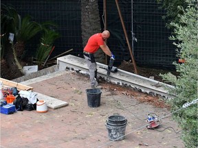 A worker is pictured inside the Vatican Nunciature-Embassy to Italy in Rome on October 31, 2018. - Bone fragments were found during construction work, a Vatican statement said experts were trying to determine the age and sex of the remains, and a possible the date of death. Italian media have speculated they may be those of a teenage 15-year-old Emanuela Orlandi daughter of a Vatican employee who vanished in 1983.