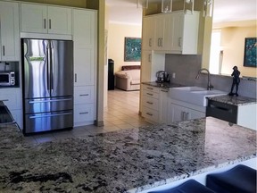 AFTER:  RenosGroup opened up the Cameron family's dated Kanata kitchen, adding new cabinets and countertops.