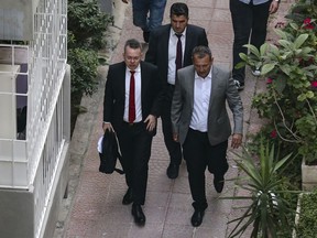 U.S. Pastor Andrew Brunson, front left, arrives at home after his release, following his trial in Izmir, Turkey, Friday, Oct. 12, 2018, A Turkish court on Friday convicted an American pastor of terror charges but released him from house arrest and allowed him to leave Turkey, in a move that is likely to ease tensions between Turkey and the United States.