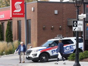 Police outside a Scotiabank on Princess Street in Kingston following  aholdup Tuesday, Oct. 9, 2018.
