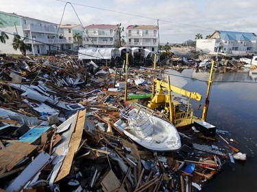 A boat sits amidst debris in the aftermath of Hurricane Michael in Mexico Beach, Fla., Thursday, Oct. 11, 2018.