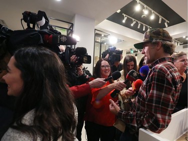 Ian Power talks with the media at the Tweed shop on Water Street in St. John's N.L. following his purchase of the first legal marijuana for recreational use in Canada at 12:01am local time on Wednesday October 17, 2018.