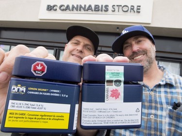Don and Aaron (last names withheld) from the United States show off their cannabis purchases outside British Columbia's first legal B.C. cannabis store in Kamloops, B.C. Wednesday, Oct. 17, 2018