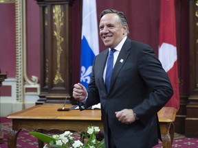 Quebec Premier designate Francois Legault walks to his wife after he was sworn in as member of the National Assembly Tuesday, October 16, 2018 at the legislature in Quebec City.