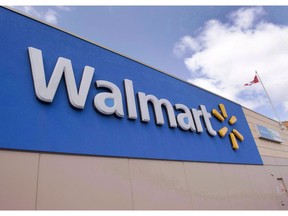 Signage at a Laval, Que., Walmart store is seen on May 3, 2016.