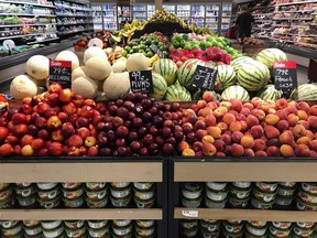 In this June 14, 2018, file photo, nectarines, plums, mangos and peaches are marked at a fruit stand in a grocery store in Aventura, Fla. The world's agriculture producers are not growing enough fruits and vegetables to feed the global population a healthy diet, according to new Canadian-led research.THE CANADIAN PRESS/AP/Brynn Anderson, File