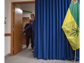 Premier of Saskatchewan Scott Moe, right, opens the door with Premier of Ontario Doug Ford prior to a media event in Saskatoon, Thursday, October 4, 2018. The federal government argues it has jurisdiction to impose a carbon tax as it's a matter of national concern in a factum filed in Saskatchewan's Court of Appeal.