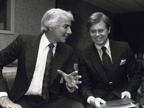 In this March 22, 1979 file photo, Philadelphia Flyers owner Ed Snider, left, talks with NHL president John Ziegler before an NHL Board of Governors meeting in Chicago. Former NHL president Ziegler has died at 84. THE CANADIAN PRESS/AP/File