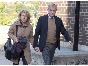 Dennis Oland and his wife Lisa arrive at Harbour Station arena in Saint John, N.B., on Monday, Oct. 15, 2018 for jury selection in the retrial in the bludgeoning death of his millionaire father, Richard Oland. Jury selection for the retrial of Dennis Oland is moving along faster than expected with 14 jurors now chosen and only two alternates left to be picked.