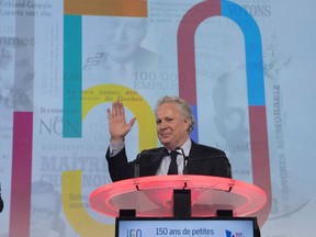 Former Quebec premier Jean Charest waves to supporters at the 150th anniversary celebrations of the Quebec Liberal Party in Quebec City on November 25, 2017. Canada's aerospace industry has appointed former Quebec premier Jean Charest to chart a new course to the final frontier. The Aerospace Industries Association of Canada is putting Charest in the cockpit to coax funding commitments and a long-term strategy from the federal government amid fears the country's star is fading.