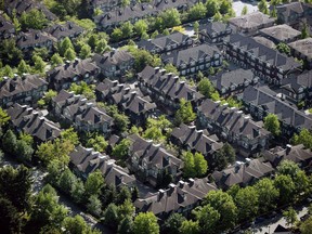 A neighbourhood of townhouses is seen in an aerial view in Richmond, B.C., on May 16, 2018. The Canadian Real Estate Association says it will soon be adding sold and historical data to its realtor.ca website.The industry group said Thursday the information will be included with new listings and be accessible without a password.