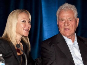 Magna International Inc. chairman Frank Stronach (right) and executive vice-chair Belinda Stronach chat at the company's annual general meeting in Markham, Ontario on Thursday May 6, 2010. An Ontario business magnate is suing his daughter, two grandchildren and others for allegedly mismanaging the family's assets and trust funds.