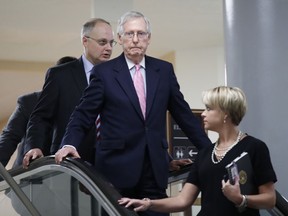 Senate Majority Leader Mitch McConnell of Ky., arrives to view the FBI report on sexual misconduct allegations against Supreme Court nominee Brett Kavanaugh, on Capitol Hill, Thursday, Oct. 4, 2018 in Washington.