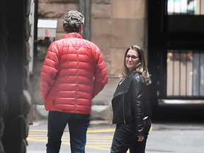Foreign Affairs Minister Chrystia Freeland and Gerald Butts, senior political advisor to Justin Trudeau, walk in the loading dock of the Office of the Prime Minister and Privy Council on Sunday.