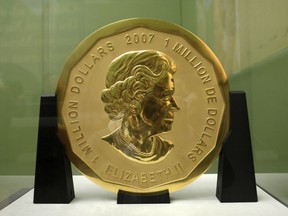 FILE -- In this Dec. 8, 2010 photo a 100-kilogram (221-pound) Canadian gold coin is displayed at the Bode Museum in Berlin, Germany. The 'Big Maple Leaf' coin, worth several million dollars, was stolen from the Bode Museum in March 2017. Berlin prosecutors said Wednesday that they have filed charges of theft against four suspects at a juvenile court in the capital.