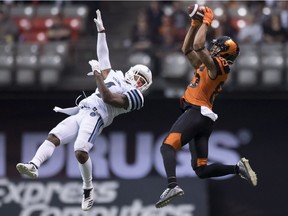 B.C. Lions wide receiver Shakeir Ryan pulls in a pass behind Toronto Argonauts defensive back Will Likely on Saturday, Oct. 6, 2018.