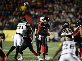 Ottawa Redblacks quarterback Trevor Harris (7) throws a pass while taking on the Hamilton Tiger-Cats on Friday, Oct. 19, 2018.