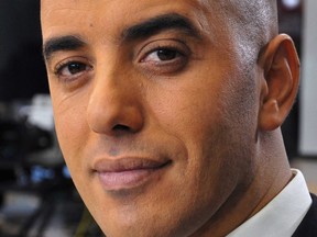 In this photo dated Nov. 22, 2010, notorious French criminal Redoine Faid poses prior to an interview with French all-news TV channel, LCI, as he was promoting his book, in Boulogne-Billancourt, outside Paris, France.