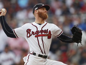 Atlanta Braves starting pitcher Mike Foltynewicz (26) delivers during the first inning in Game 4 of baseball's National League Division Series between the Atlanta Braves and the Los Angeles Dodgers, Monday, Oct. 8, 2018, in Atlanta.