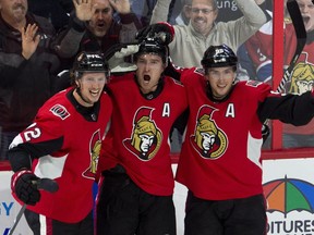 Ottawa Senators right wing Mark Stone celebrates his game-winning goal with teammates Thomas Chabot (72) and centre Matt Duchene (95) during overtime NHL action against the Montreal Canadiens, in Ottawa on Saturday, Oct. 20, 2018.