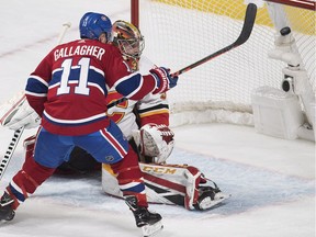 Calgary Flames goaltender David Rittich is scored on by Montreal Canadiens' Brendan Gallagher during second period NHL hockey action in Montreal, Tuesday, October 23, 2018.