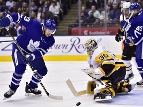 Toronto Maple Leafs centre Frederik Gauthier (33) and Pittsburgh Penguins goaltender Matt Murray (30) watch the puck during second-period NHL hockey action in Toronto on Thursday, October 18, 2018.