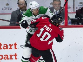 Dallas Stars defenceman Connor Carrick collides with Ottawa Senators left wing Tom Pyatt during first period NHL action Monday October 15, 2018 in Ottawa.