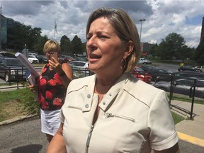 Carol Anne Meehan speaks with reporters outside the city election office on Cyrville Road on Friday, July 27, 2018 after registering to run in Gloucester-South Nepean ward in the Oct. 22 municipal vote.